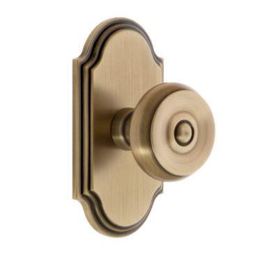 Grandeur Bouton Door Knob Set with Arc Rose in Vintage Brass