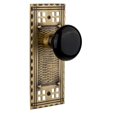 Nostalgic Warehouse Craftsman Backplate with Black Porcelain Knob Antique Brass