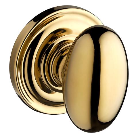 Baldwin Reserve Ellipse Knob with round rose (TRR) shown in Polished Brass (030)