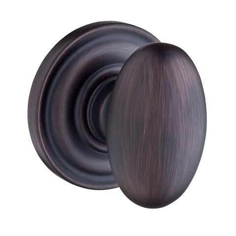 Baldwin Reserve Ellipse Knob with round rose (TRR) shown in Venetian Bronze (112