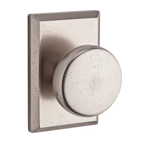 Baldwin Reserve Rustic Knob shown with Square Rose in White Bronze (492)