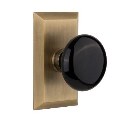 Nostalgic Warehouse Studio Plate with Black Porcelain Knob Antique Brass 